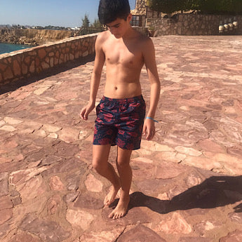 Blue turtle print board shorts