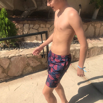 Blue turtle print board shorts