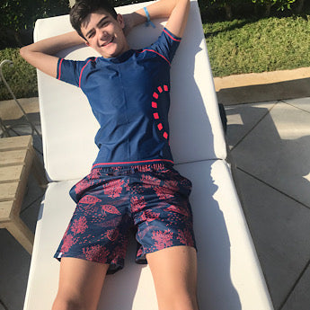 Blue turtle print board shorts